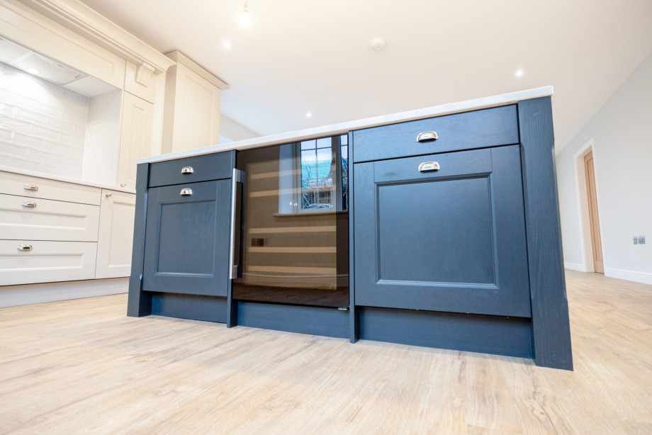 A large kitchen island-shaker style