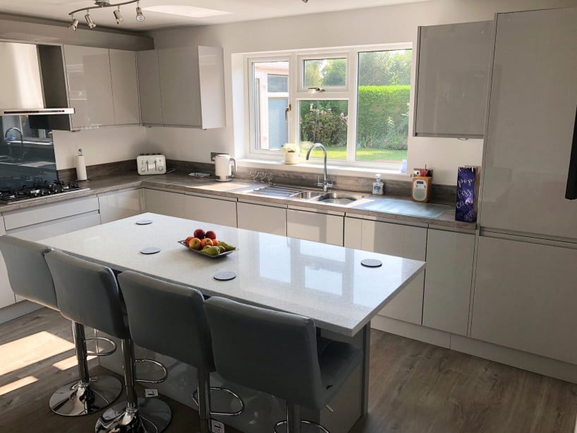 Cabinets with J Pull handles in modern kitchen