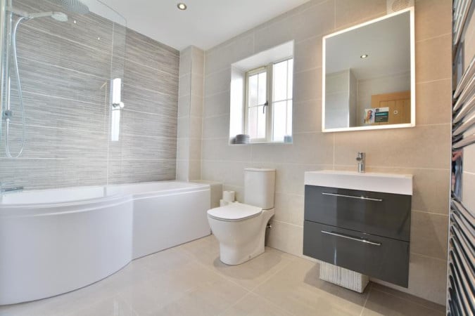 A grey bathroom plays with texture and shade