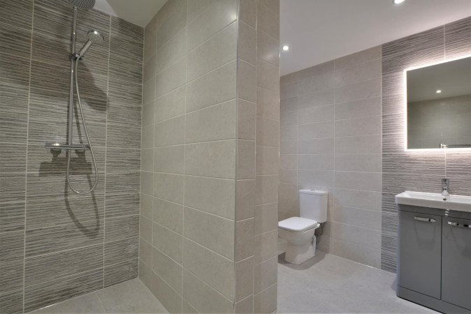 Texture rules in this grey bathroom