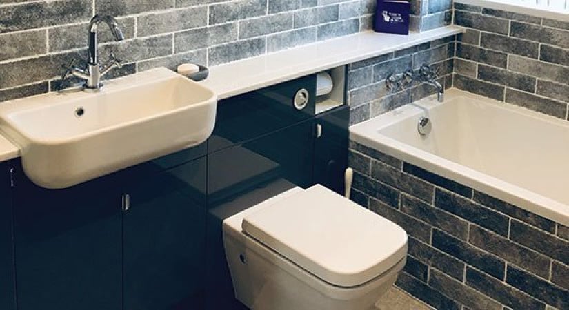 Dramatic black gloss setting for a wall-hung toilet